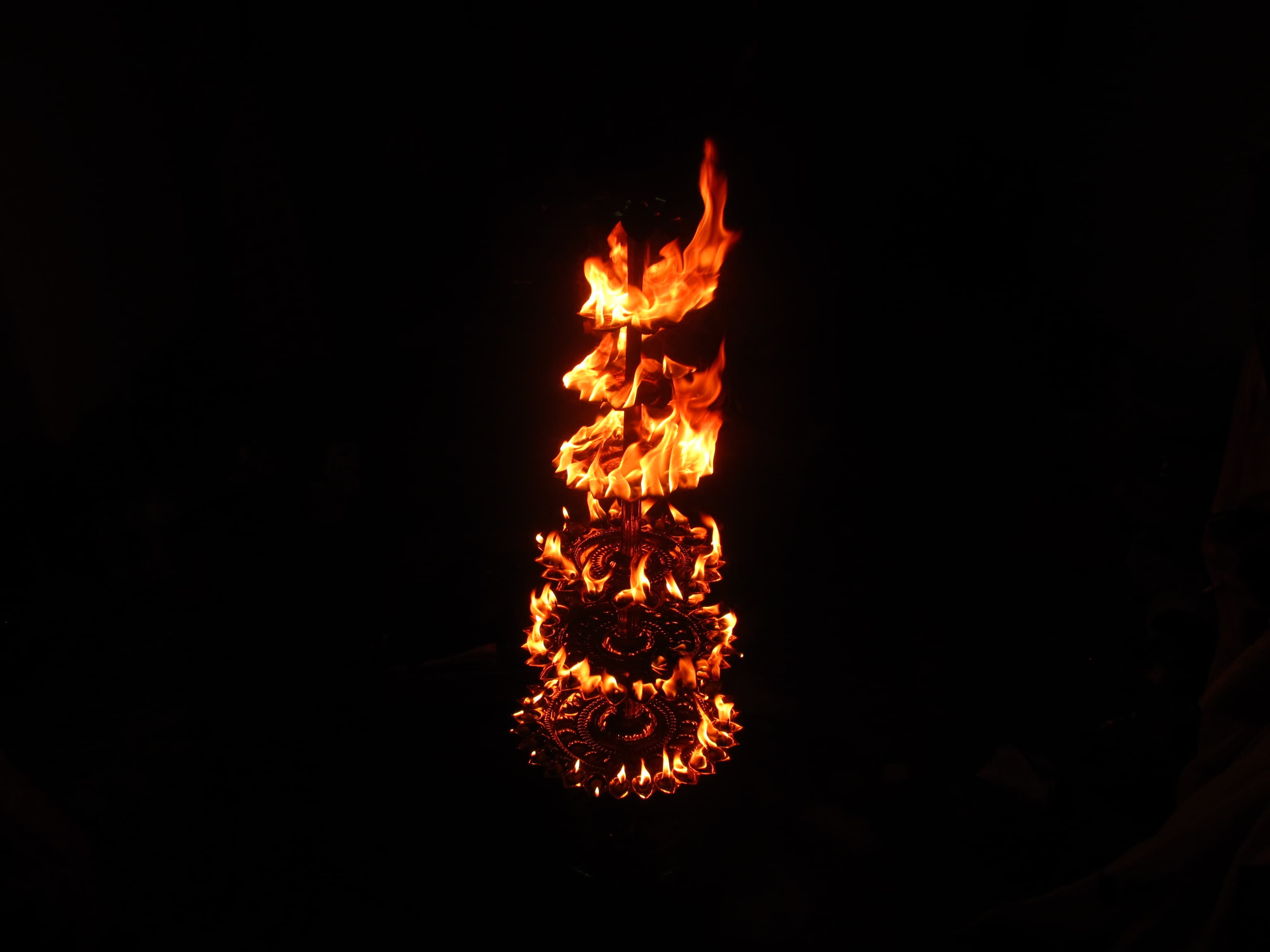 A circular arrangement of glowing diyas
